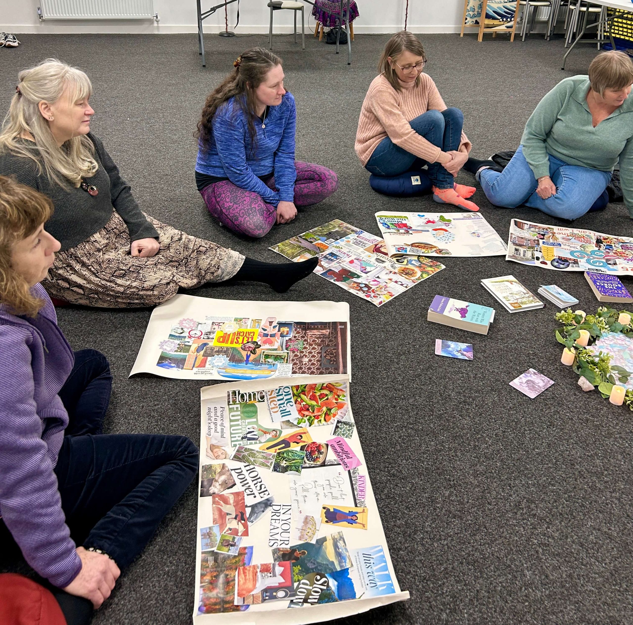 circle of women with vision board ideas and creations